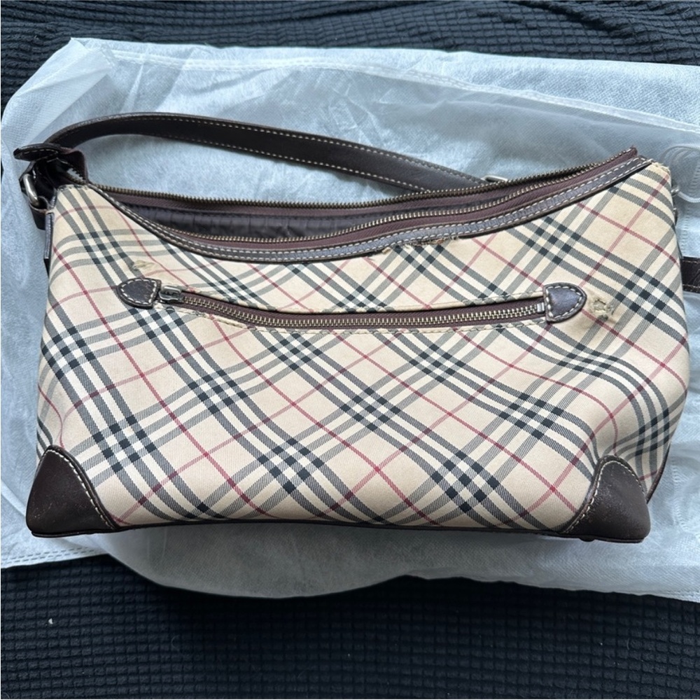 Authentic Burberry Shoulder Bag
Classic Nova check beautiful but has Flaws! - Picture 8 of 8